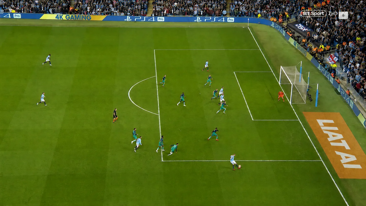 A digital sponsor banner placed on the grass by Liat.ai, beside the penalty area in live match footage.