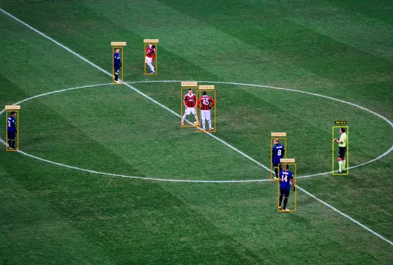 Liat.ai player detection at kickoff: every player and the referee boxed and given a tracking ID.